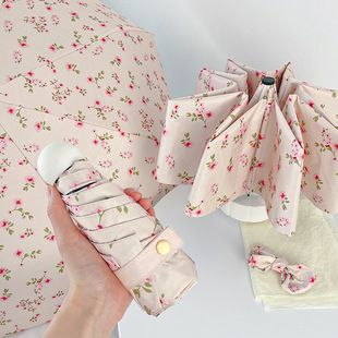 چتر تاشو ضدآفتاب و بارانی طرح شکوفه صورتی