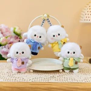کیف دکمه‌دار دخترانه با طرح خال‌خالی و عروسک گوسفند پشمی کوچک، مناسب برای جاکلیدی و اسباب‌بازی کودک
